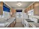 Well-lit kitchen with white appliances, ample cabinet space, and tile flooring at 3412 Winterhaven St # 101, Las Vegas, NV 89108