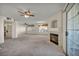 Bright living room with a fireplace, ceiling fans, and sliding glass doors at 3412 Winterhaven St # 101, Las Vegas, NV 89108