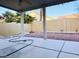 A covered backyard patio offers a view of desert landscaping at 3438 Ceremony Dr, Las Vegas, NV 89117