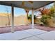 A covered backyard patio offers a view of desert landscaping at 3438 Ceremony Dr, Las Vegas, NV 89117