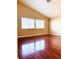 Bright bedroom with hardwood floors and large windows at 3438 Ceremony Dr, Las Vegas, NV 89117