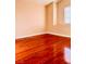 A bright bedroom featuring hardwood floors, a neutral color scheme, and natural light at 3438 Ceremony Dr, Las Vegas, NV 89117