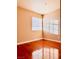 A bright bedroom featuring hardwood floors, a neutral color scheme, and natural light at 3438 Ceremony Dr, Las Vegas, NV 89117