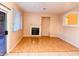 Bright living room featuring laminate flooring, a fireplace, and ample natural light at 3438 Ceremony Dr, Las Vegas, NV 89117