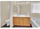 Bathroom with double sink vanity, bathtub, and toilet area at 3941 Yellow Mandarin Ave, North Las Vegas, NV 89081