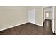 Bedroom showing modern flooring, closet with doors and a hall to the next room at 3941 Yellow Mandarin Ave, North Las Vegas, NV 89081