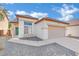 Charming single-story home featuring a two-car garage and well-maintained front yard landscaping at 3941 Yellow Mandarin Ave, North Las Vegas, NV 89081