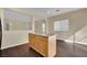 Kitchen with a center island, hardwood floors and adjacent living area at 3941 Yellow Mandarin Ave, North Las Vegas, NV 89081