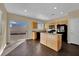 Eat-in kitchen featuring an island, dark appliances, and hardwood floors at 3941 Yellow Mandarin Ave, North Las Vegas, NV 89081