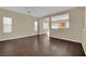 Spacious living room featuring hardwood floors, neutral walls and window coverings at 3941 Yellow Mandarin Ave, North Las Vegas, NV 89081