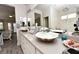 Elegant bathroom with a shell-shaped vessel sink, granite countertops, and a large mirror at 4300 S Gressa St, Pahrump, NV 89061