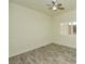 Minimalist bedroom design with wood-look floors and shuttered windows at 4300 S Gressa St, Pahrump, NV 89061