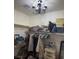 Spacious walk-in closet with shelving, hanging racks, a chandelier, and plenty of storage at 4300 S Gressa St, Pahrump, NV 89061