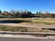 Serene golf course view showcasing a tranquil pond and the lush greenery at 4300 S Gressa St, Pahrump, NV 89061