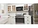 Updated kitchen featuring stainless steel appliances, subway tile backsplash, and shaker style cabinets at 4300 S Gressa St, Pahrump, NV 89061