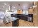 Bright kitchen featuring stainless steel appliances, contrasting cabinetry and large island at 4412 Denia Cir, Las Vegas, NV 89108