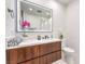 Modern bathroom features a floating vanity, stylish lighting, and light mirror at 4515 Dean Martin Dr # 201, Las Vegas, NV 89103