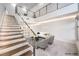 Bright and airy living room featuring a modern staircase and sleek, minimalist design at 4515 Dean Martin Dr # 201, Las Vegas, NV 89103