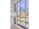 Floor-to-ceiling windows offer a view of the cityscape beyond the balcony railing at 4515 Dean Martin Dr # 201, Las Vegas, NV 89103