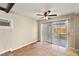 The dining area features tile floors, a ceiling fan, and sliding glass doors to the backyard at 4606 Cory Pl, Las Vegas, NV 89107