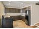 This kitchen features tile floors, countertops, and a modern range at 4606 Cory Pl, Las Vegas, NV 89107