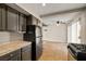 The kitchen adjoins the dining area, which has a ceiling fan and glass door at 4606 Cory Pl, Las Vegas, NV 89107