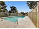 Clean community pool surrounded by a gated fence at 4648 Comnor Hill Ln, Las Vegas, NV 89121