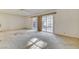 Interior view of the living room featuring sliding glass doors to a covered patio and ready for personalized updates at 4648 Comnor Hill Ln, Las Vegas, NV 89121