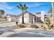 Attractive home with a two-car garage, desert landscaping, and solar panels on the roof at 4809 Mountain Valley Rd, Las Vegas, NV 89121