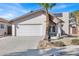 Charming single-story home with stucco siding, a two-car garage, and desert landscaping at 4809 Mountain Valley Rd, Las Vegas, NV 89121