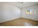 Bright bedroom with neutral tile flooring and a large window at 4911 W Pebble Rd, Las Vegas, NV 89139