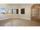 Bedroom with tile flooring, a ceiling fan, and views of the surrounding desert at 4911 W Pebble Rd, Las Vegas, NV 89139