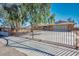 Metal driveway gate with the home's address providing a private entrance at 4911 W Pebble Rd, Las Vegas, NV 89139