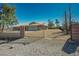 Gated property featuring gravel landscaping and a view of the house at 4911 W Pebble Rd, Las Vegas, NV 89139