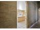 Kitchen area featuring tile floors and light-colored cabinets at 4911 W Pebble Rd, Las Vegas, NV 89139