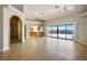 Bright living room with tile flooring and a large sliding glass door to the backyard at 4911 W Pebble Rd, Las Vegas, NV 89139