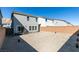 View of the home's backyard featuring desert landscaping and a block fence for privacy at 5382 El Nevero St, Las Vegas, NV 89166