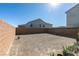 Large, enclosed backyard with gravel and potted plants at 5382 El Nevero St, Las Vegas, NV 89166