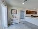 Modern dining area featuring a slider and view of kitchen at 5382 El Nevero St, Las Vegas, NV 89166