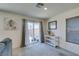 Bright dining area with sliding glass door and a view of the outdoor space and kitchen at 5382 El Nevero St, Las Vegas, NV 89166