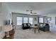 Bright and airy living room with large windows and plush seating at 5382 El Nevero St, Las Vegas, NV 89166