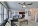 Bright living room boasts a modern ceiling fan and an open layout to the kitchen at 5382 El Nevero St, Las Vegas, NV 89166