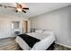 Comfortable bedroom featuring a queen-size bed, mirrored closet doors and wood-look flooring at 5827 Delonee Skies Ave, Las Vegas, NV 89131