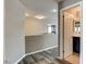 Second floor hallway featuring wood-look flooring, neutral walls and access to a bathroom at 5827 Delonee Skies Ave, Las Vegas, NV 89131