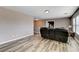 An inviting upstairs living room showcasing new wood floors and neutral paint at 5827 Delonee Skies Ave, Las Vegas, NV 89131