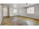 Bright living room with custom floors and modern light fixture by the front door at 5827 Delonee Skies Ave, Las Vegas, NV 89131