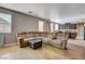 Cozy living room showcases custom floors and seamlessly connects to the open-concept kitchen at 5827 Delonee Skies Ave, Las Vegas, NV 89131