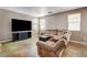 Relax in this living room featuring custom flooring and an entertainment center for the tv at 5827 Delonee Skies Ave, Las Vegas, NV 89131