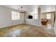 Living room showcases custom floors, modern lighting, and seamless flow into the cozy sitting area at 5827 Delonee Skies Ave, Las Vegas, NV 89131