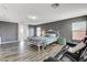 Spacious main bedroom featuring hardwood flooring and a cozy seating area at 5827 Delonee Skies Ave, Las Vegas, NV 89131